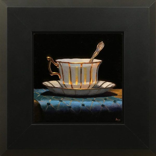 Gold-Trimmed Teacup and Blue Silk Brocade